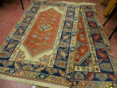 TWO TURKISH HAND KNOTTED FINE DOSEMEARTI RUGS, both multi-bordered with predominant green and red