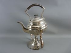 AN ELECTROPLATED SPIRIT KETTLE on a stylized stand with burner by Hukin & Heath, 36 cms high