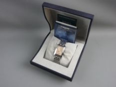 A LONGINES GENT'S WRISTWATCH with champagne coloured dial and stainless steel strap, in original