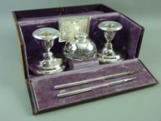 A CASED DESK SET OF BIRMINGHAM HALLMARKED SILVER ITEMS of calendar, inkwell, pen and pencil by