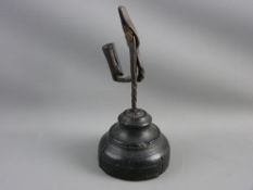 AN ANTIQUE WROUGHT IRON RUSH LIGHT HOLDER, late 18th/early 19th Century in twisted form, the nip