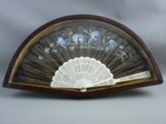 A HAND PAINTED BLACK SILK & CARVED BONE VINTAGE FAN in a mahogany display case, 57.5 cms wide the