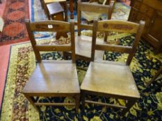 A PAIR OF ANTIQUE OAK ANGLESEY FARMHOUSE CHAIRS and one other, the pair having inset mahogany