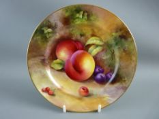 A ROYAL WORCESTER FRUIT DECORATED SIDE PLATE, signed 'Moseley', 18 cms diameter, gilt rimmed with