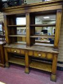 A VINTAGE OAK MIRROR BACK PUB SIDEBOARD, the upper section having a stepped cornice with an open