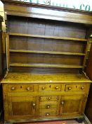 AN EARLY 19th CENTURY NORTH WALES OAK DRESSER of excellent colour and patina, the three shelf box