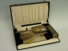 Silver three piece Art Deco mirror and brush set cased
