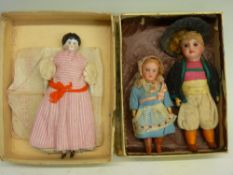 Three dressed vintage dolls