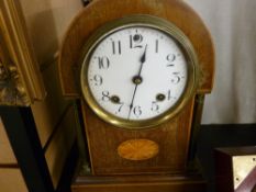 Mahogany mantel clock with shell inlay