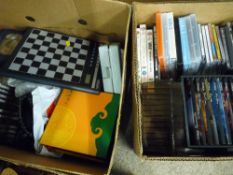 Box of mixed CDs and DVDs and a box of similar items including electronic chess game etc