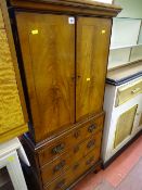 Antique style entertainment cupboard with two doors over a false drawer bottom
