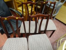 Four dark wood upholstered dining chairs
