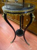 Black occasional table with brass/gilt ornate decoration