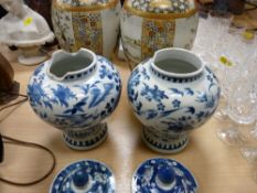 Pair of Satsuma vases and a pair of blue and white lidded Oriental vases