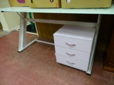 Metal framed glass topped desk and a small three drawer chest