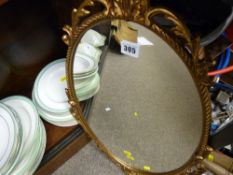 Gilt framed oval hall mirror
