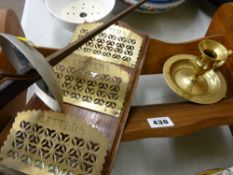 Bookshelf, brass candleholder, a brass and timber letter rack and an old fencing foil