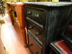 Pine table with turned supports and speckled top and a small black painted chest of two drawers with