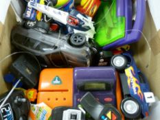 Box of mixed toys including remote control cars etc