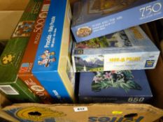 Box containing quantity of jigsaws