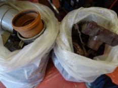 Two plastic bags of roof guttering, plastic fitments and accessories