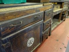 Vintage workbench with two drawers over a base shelf and another unit of three side drawers, a