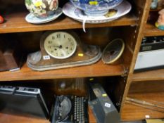 Two polished mantel clocks and a vintage radio