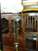 Brass effect modern standard lamp and a portable halogen electric heater E/T