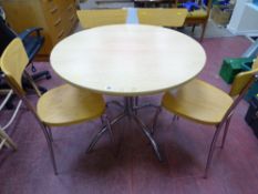 Ultra modern light wood circular table with chrome centre support and legs and four matching