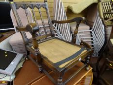 Polished wooden armchair with an interestingly carved back