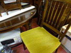 Dark wood polished circular dining table and four Stag spindlebacked upholstered chairs