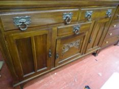 Railback sideboard with three upper drawers and three lower cupboards
