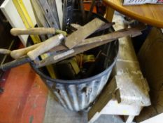 Black bin with vintage hand tools, spirit levels and a wooden workhorse