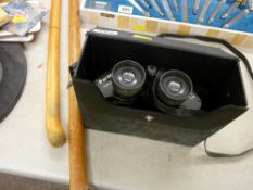 Two vintage walking sticks and a cased set of binoculars