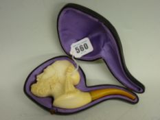 Carved Meerschaum pipe with amber mouthpiece in a fitted satin lined case