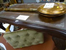 Leather tooled top coffee table, a small upholstered footstool and a brass warming pan