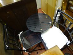Small black metal outdoor table and two folding chairs