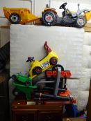 Child's JCB tractor and trailer, a child's Black & Decker workbench, lawnmower and wheelbarrow and a