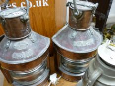 Copper port and starboard lamps and an old carry lantern
