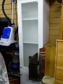 White two door bathroom cabinet, three section ornamental mirror, light wood stand and a glass