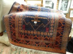 A small Indian woollen blue & rust patterned rug