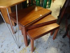 A nest of three teak wood tables by Gordon Russell