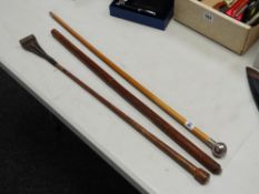 Three swagger sticks, one with a hallmarked silver Welch Regiment finial & inscribed Major Cutler