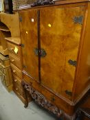 Reproduction walnut veneered mirror back drinks cabinet on raised feet