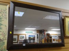 A modern leather effect framed wall mirror