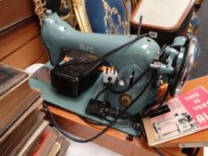 A vintage cased Alfa model 65 electric sewing machine E/T