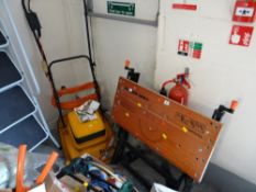 An Allen hover lawn mower together with a Black & Decker workmate E/T