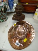 A copper snake decorated mould together with a vintage African boy money box