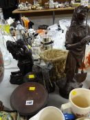 A continental spelter figure of a female farm worker together with a collection of resin figures