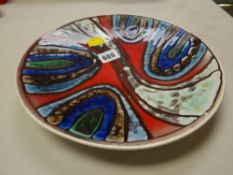 A Poole coloured glazed charger